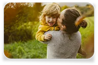 woman hugging child photograph
